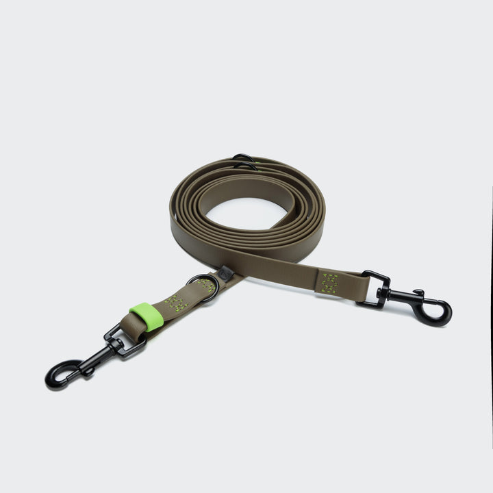 Cloud7 - IPANEMA Adjustable Dog Leash BioThane in olive with black hardware and neon green detail, rolled and extended.