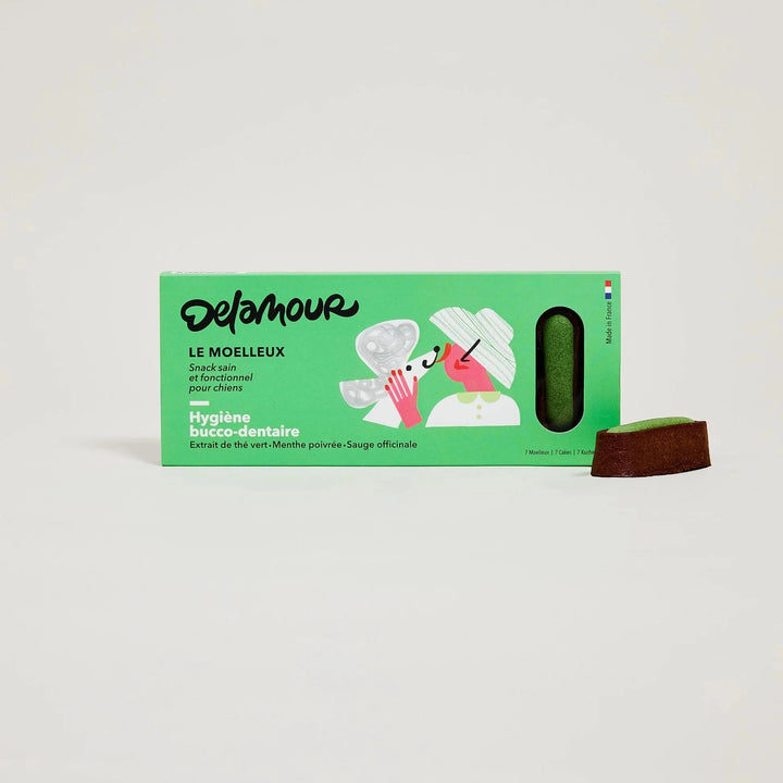 DeLamour - Le Moelleux Higiene bucal Vegan snacks para cães em caixa verde com uma mastigação castanha ao lado sobre fundo branco