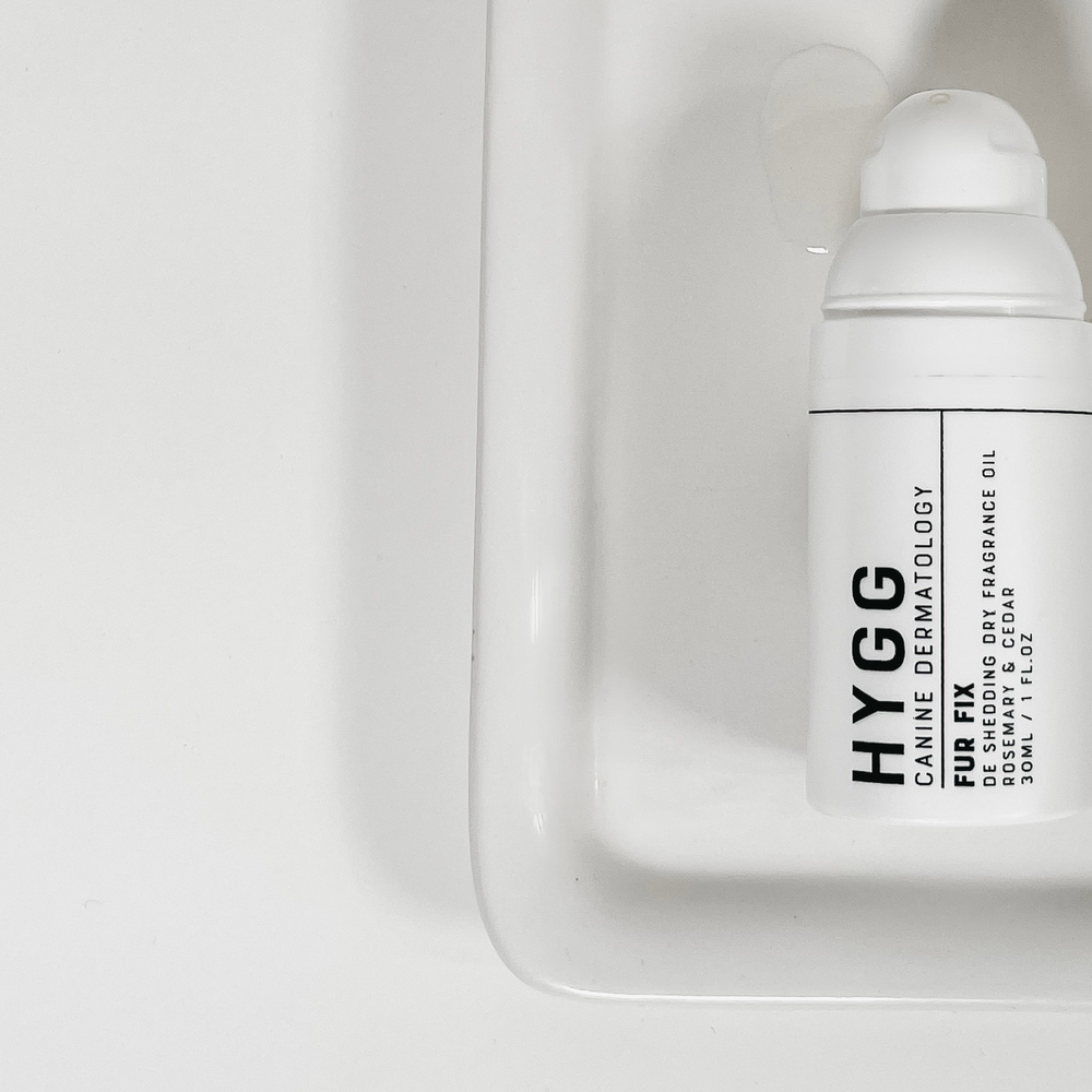 White bottle of FUR FIX dry fragrance oil for dog coat care and shine enhancement by Hygg