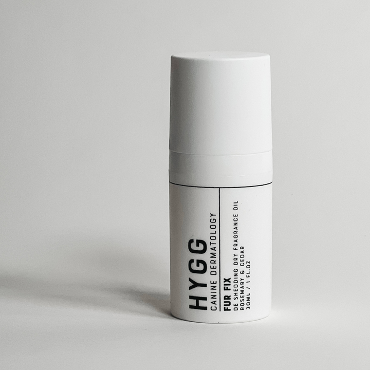 White bottle of non-residue dry dog cologne for fur shine and care, FUR FIX Fragrance by Hygg.