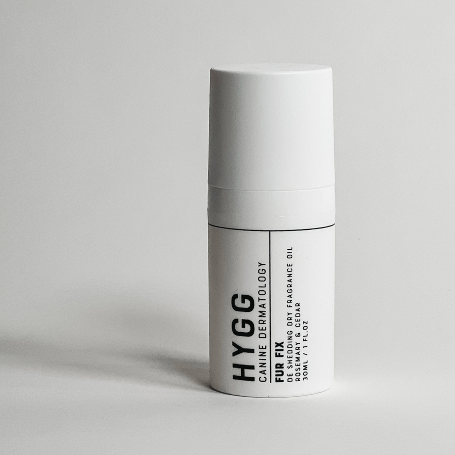 White bottle of non-residue dry dog cologne for fur shine and care, FUR FIX Fragrance by Hygg.