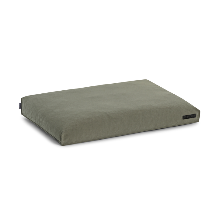 MiaCara COMODO dog cushion in muted green with soft, structured surface for optimal comfort and support of natural nesting behavior