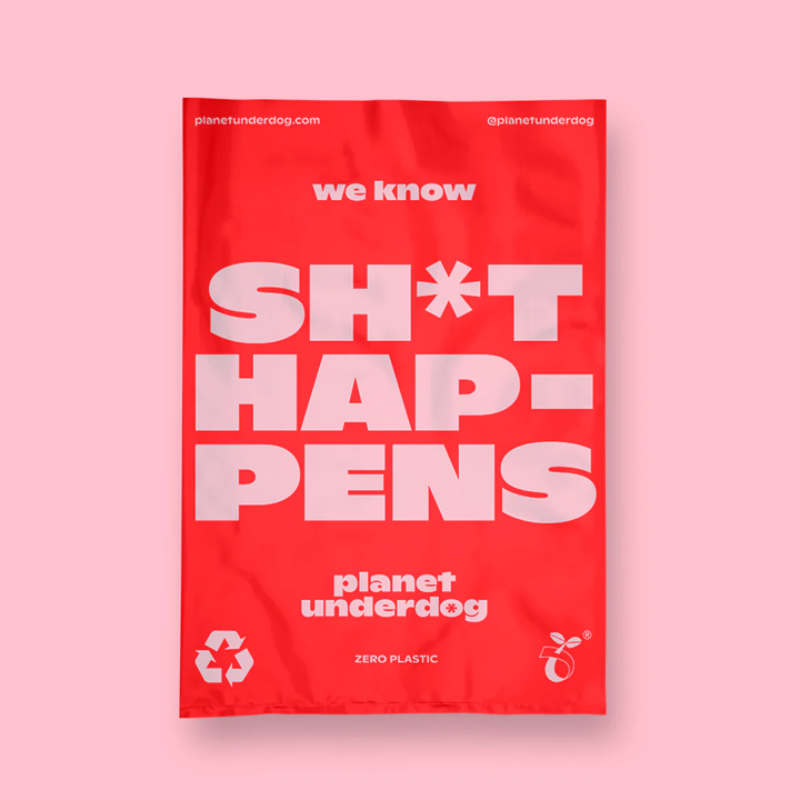 Red compostable dog poop bag made from sustainable materials by Planet Underdog for eco-friendly pet waste disposal