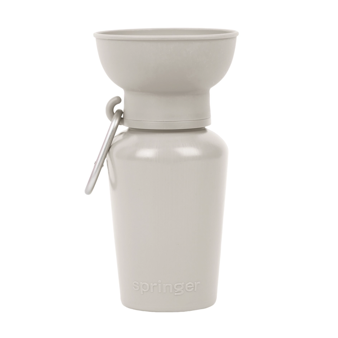 Springer FLIP eco-friendly dog water bottle in beige with retractable silicone bowl for sustainable pet hydration on the go