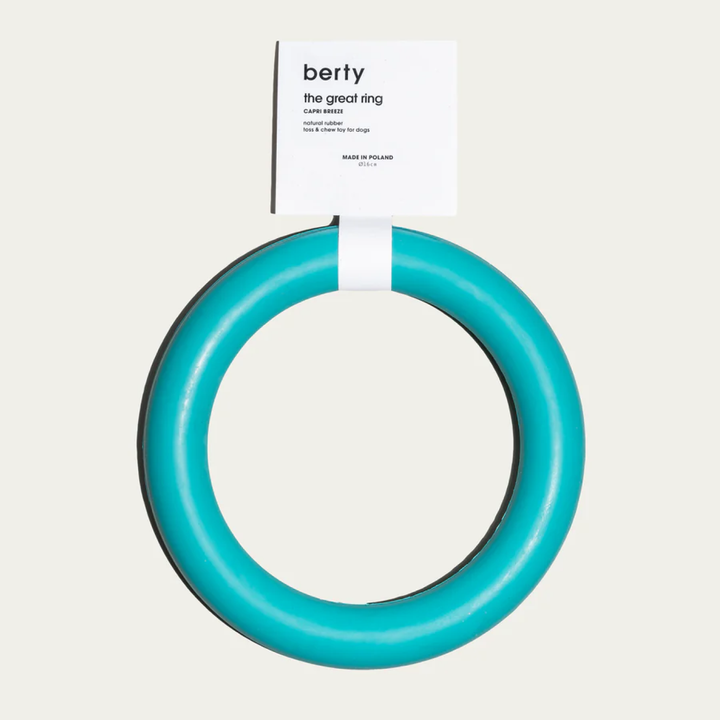 Bright turquoise toss and chew toy for dogs called 'The Great Ring' by Berty, made from durable natural rubber. This eco-friendly, stimulating dog toy is perfect for eco-conscious dog owners seeking sustainable dog accessories for play and exercise. Ideal for promoting dog wellness through interactive play while using environmentally friendly materials.