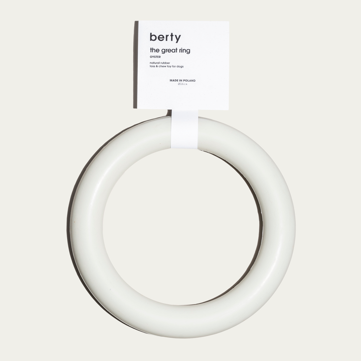 Berty 'The Great Ring' dog toy in an oyster color, made from natural rubber. This eco-friendly chew and toss toy is perfect for conscious dog parents seeking durable, sustainable dog accessories for interactive play. Ideal for promoting dog wellness and keeping pets active while using environmentally friendly materials.