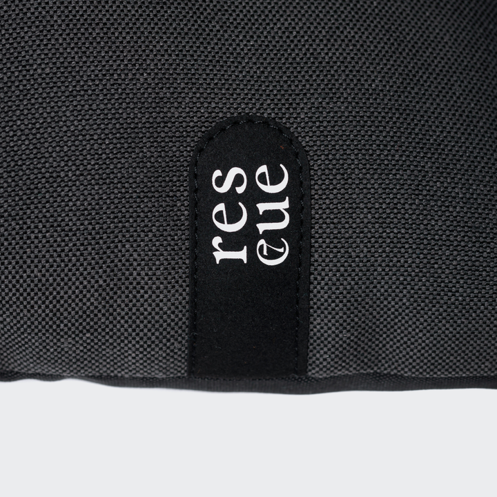 Close-up of the waterproof fabric label on the Cloud7 - RESC7UE Dog Pillow for indoor and outdoor use.