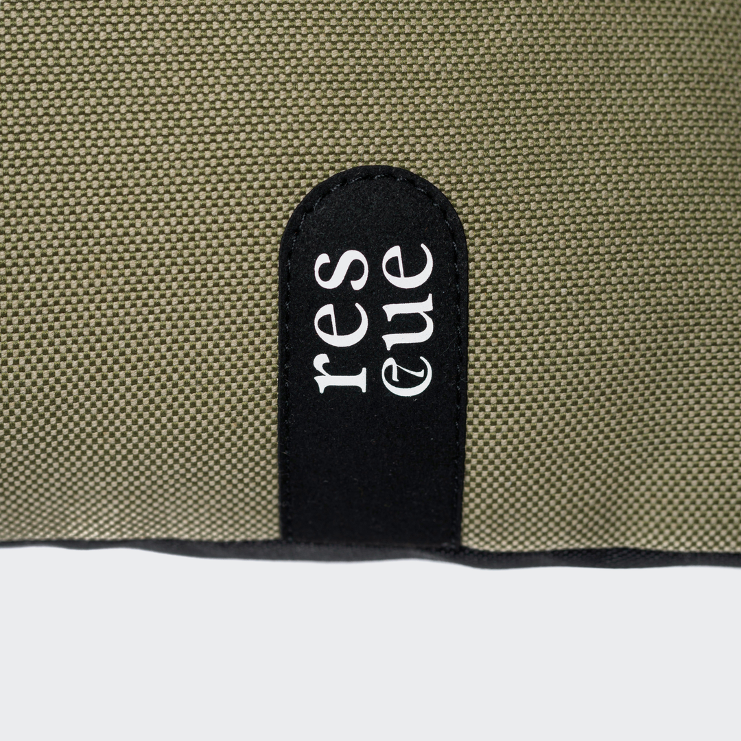 Close-up of waterproof fabric detail on Cloud7 - RESC7UE Dog Pillow showing durable stitching and label.