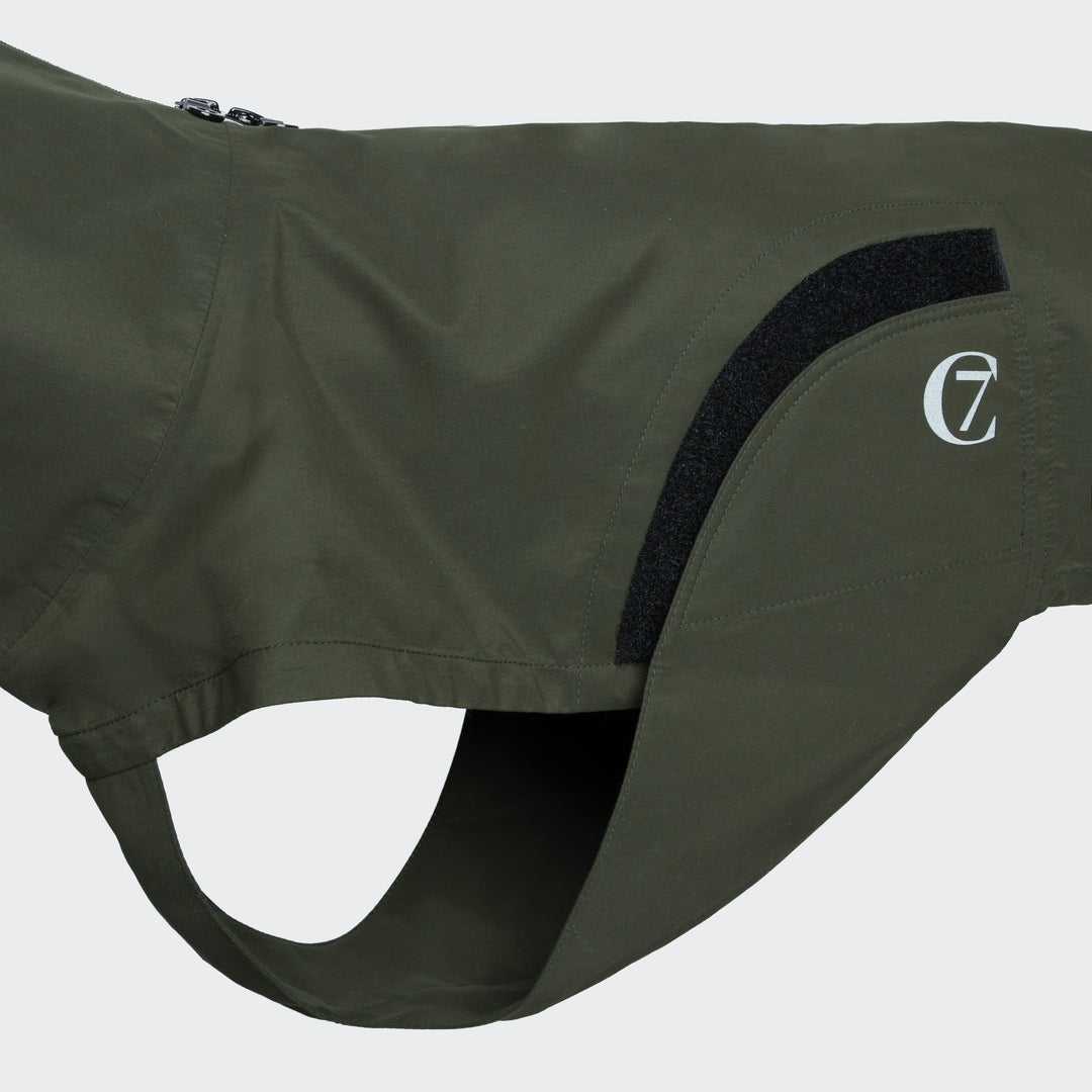 Close-up of Cloud7 - Dog Raincoat Dublin in olive green showing water-repellent fabric and adjustable features.