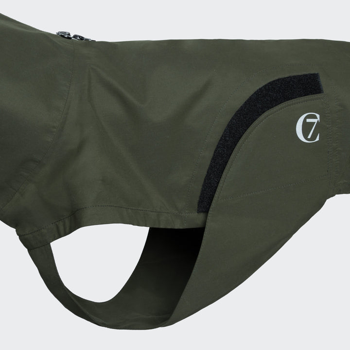 Close-up of Cloud7 - Dog Raincoat Dublin in olive green showing water-repellent fabric and adjustable features.