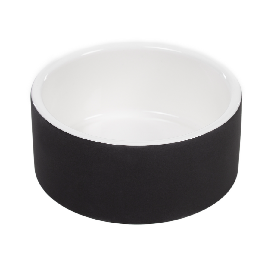 A modern, cool dog bowl with a sleek black exterior and white interior, designed to keep water at a cool temperature. This premium, eco-friendly accessory is perfect for conscious dog owners seeking durable, high-quality dog gear that complements a sustainable pet lifestyle.